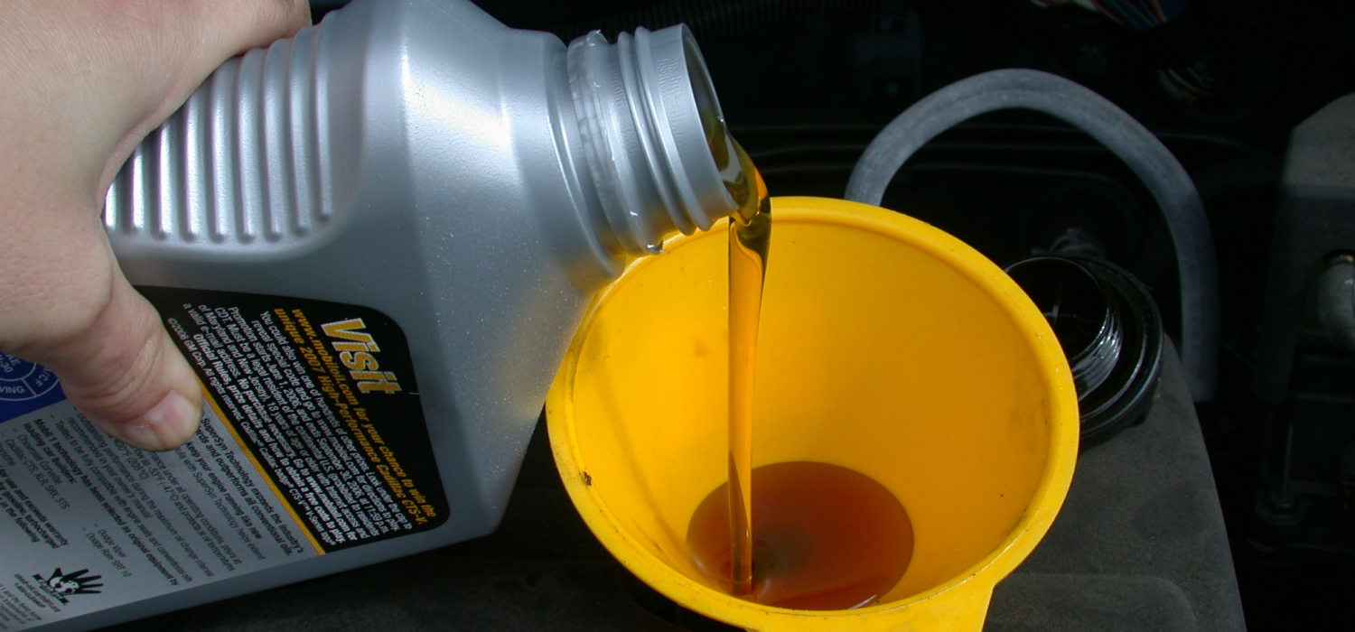 Motor_oil_refill_with_funnel.jpg